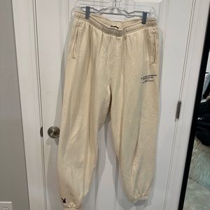PacSun X Playboy cream sweatpants with black writing size large